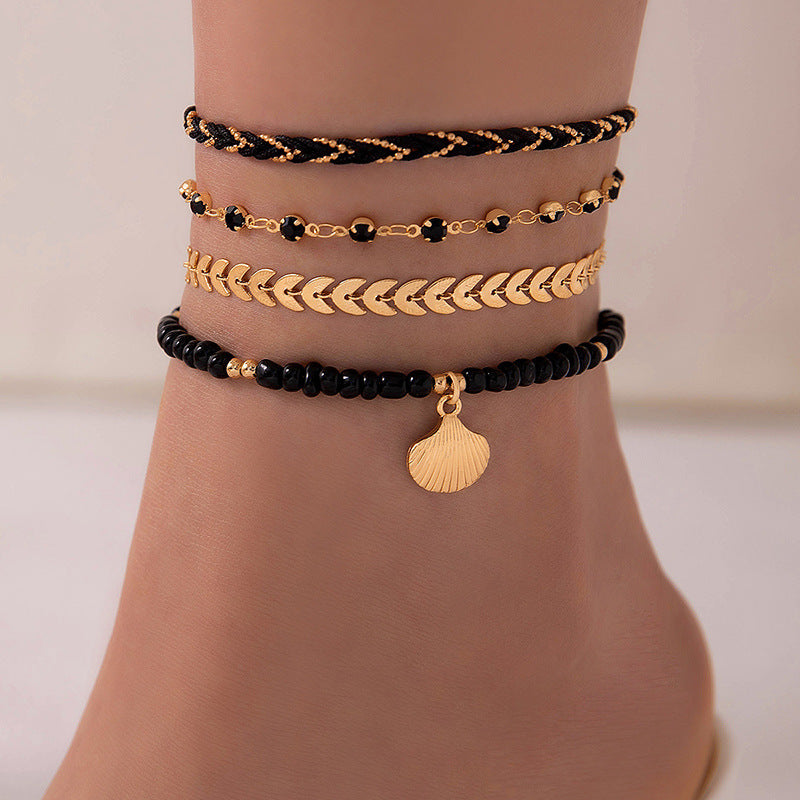 Lot de 4 bracelets de cheville bohèmes – Cordons tressés et perles noires