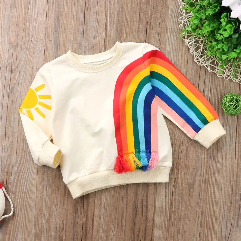 Sweat coloré bébé fille – Arc-en-ciel, chaleur et bonne humeur.